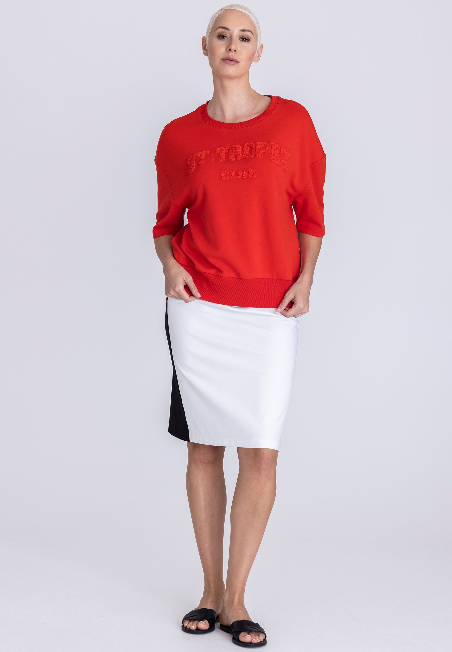red sweatshirt, crew neck, short sleeves, color block skirt, white black skirt
