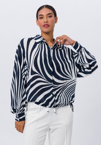 Bluse mit Allovermuster und Print